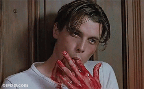 Man With Blood On Hands Biting Nails GIF