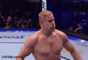 Man With Bloody Head Standing By Sign GIF