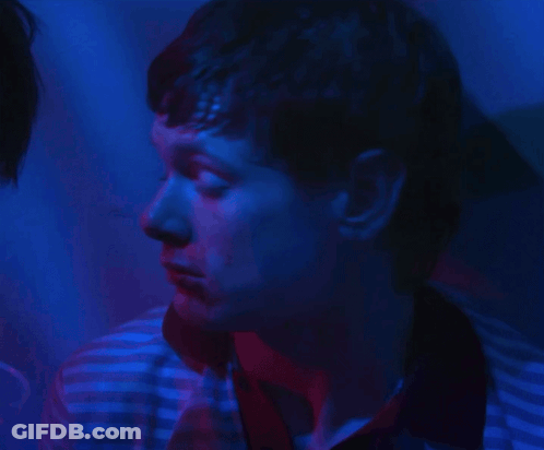 Man With Blue And Red Light Behind Him GIF