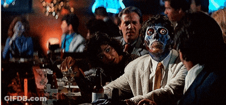 Man With Blue Face Sitting At Bar GIF
