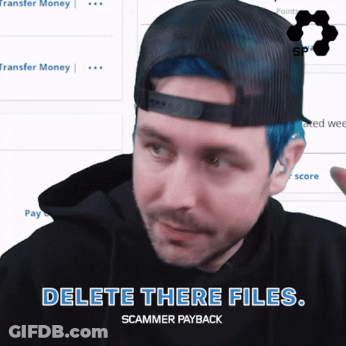 Man With Blue Hair And Black Hat Says Delete Those Files GIF