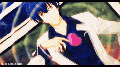 Man With Blue Hair And Red Eyes Holding Heart GIF