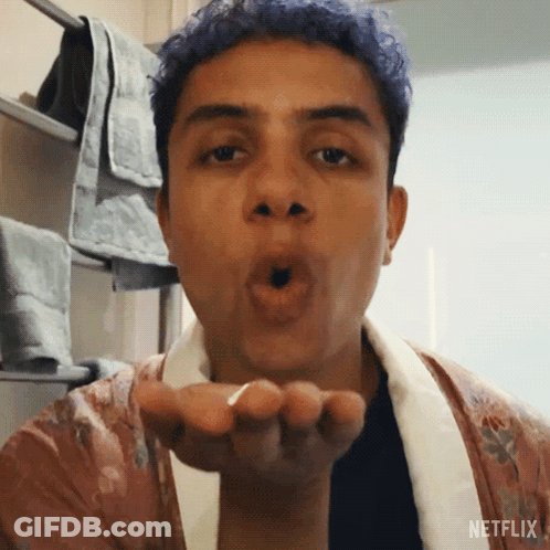 Man With Blue Hair Blowing Kiss GIF