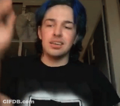Man With Blue Hair In Black T-Shirt Making Face GIF