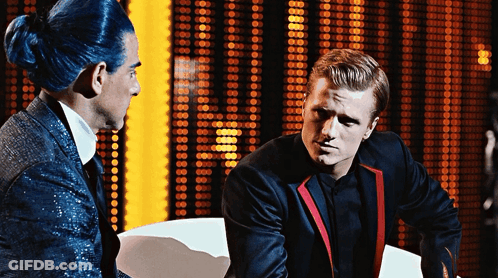 Man With Blue Hair Talks To Man In Suit GIF