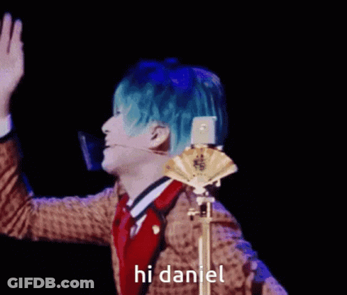 Man With Blue Hair Waving Saying Hi Daniel GIF