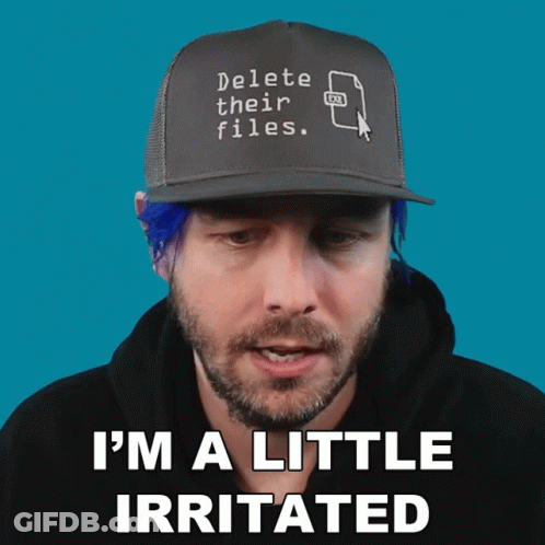 Man With Blue Hair Wearing Delete Their Files Hat GIF