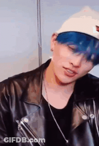 Man With Blue Hair White Hat Leather Jacket And Necklace GIF