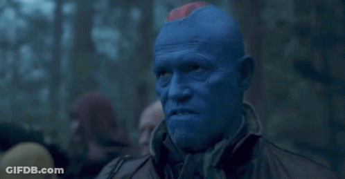 Man With Blue Paint Looking GIF