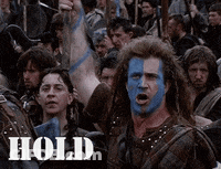 Man With Blue Paint On Face Saying Hold GIF