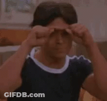 Man With Blue Shirt Making Funny Face Fingers Up GIF