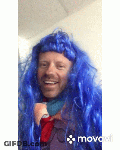 Man With Blue Wig Smiling Movado Video GIF