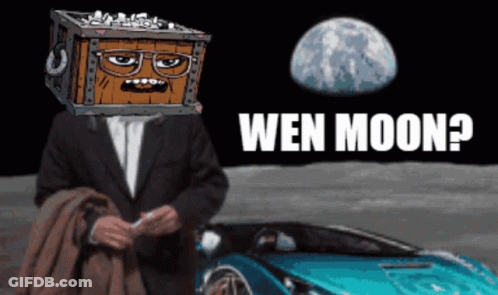 Man With Box On Head Sitting In Front Of Blue Car With Wen Moon GIF