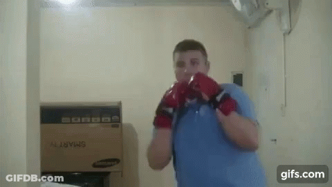 Man With Boxing Gloves And Box GIF