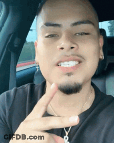 Man With Braces Peace Sign In Back Seat GIF