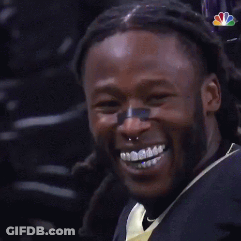 Man With Braces Smiling In NFL Jersey GIF