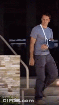 Man With Broken Arm Cast Walking Down Stairs GIF