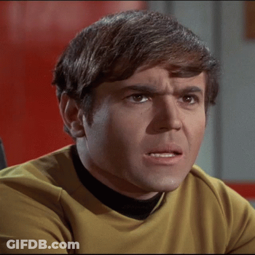 Man With Brown Hair And Yellow Shirt Making Funny Face GIF