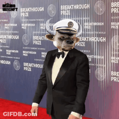 Man With Bull Head In Front Of Breakthrough Prize Wall GIF