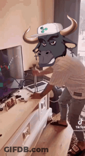 Man With Bull's Head Standing In Front Of TV GIF