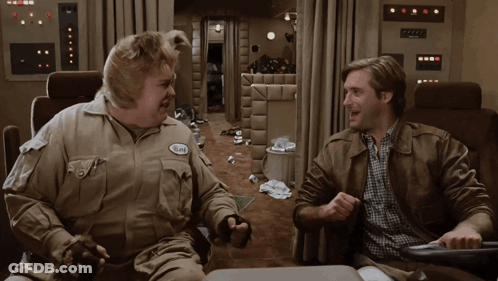 Man With Burt Name Tag Sitting GIF