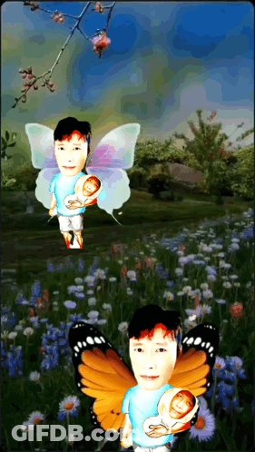 Man With Butterfly Wings Holding Baby GIF