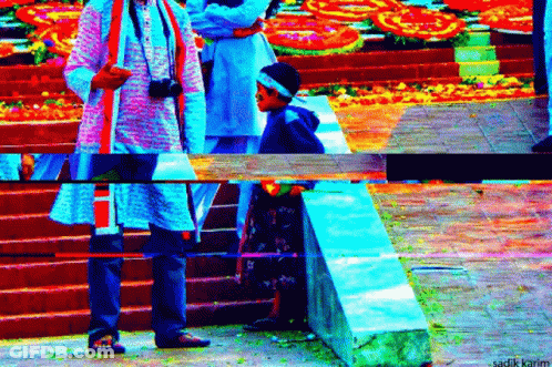 Man With Camera Next To Boy With Headband GIF