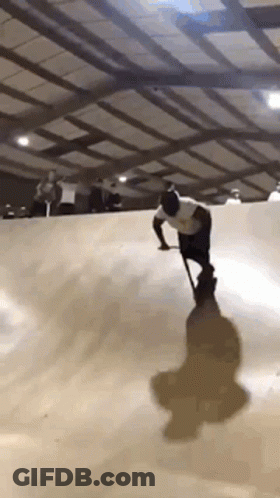 Man With Cane Riding Skateboard GIF