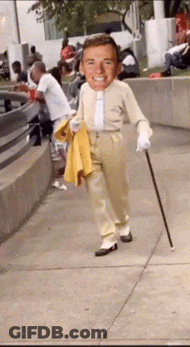 Man With Cane Walking Down Sidewalk GIF