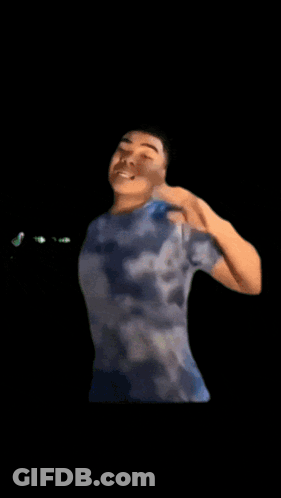 Man With Cartoon Character On Head Wearing OK Shirt GIF