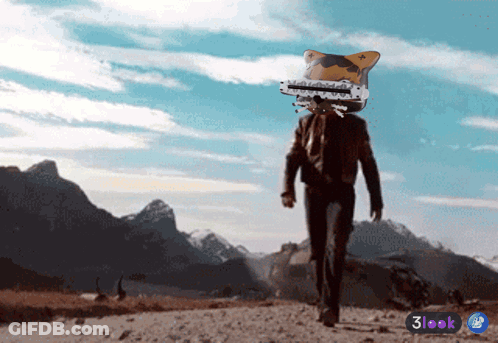 Man With Cat Head Walking Mountain Road GIF