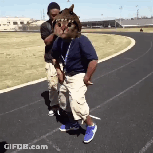 Man With Cat On Head Next To Man On Track GIF