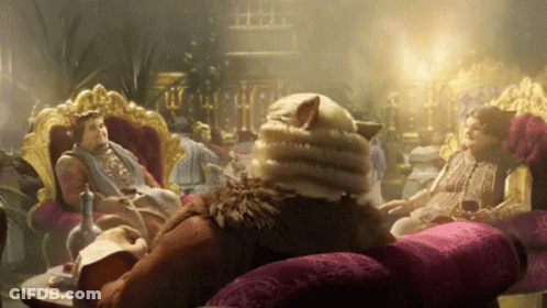 Man With Cat's Head Sitting On Couch GIF