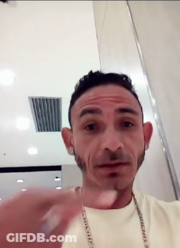 Man With Chain Around Neck Making Funny Face GIF