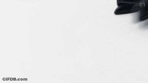 Man With Chain Standing Before WTF Sign GIF