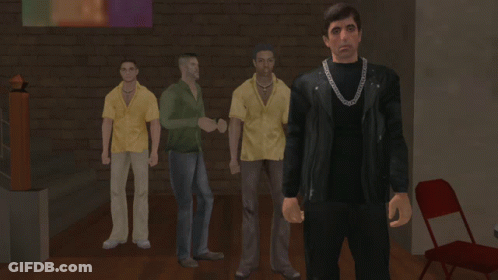 Man With Chain Standing In Room GIF