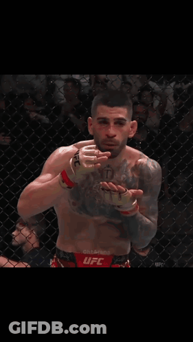 Man With Chest Tattoo And UFC Glove GIF