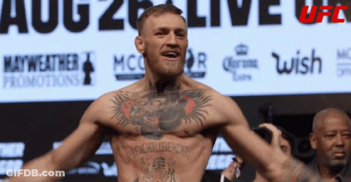 Man With Chest Tattoo And UFC Sign GIF