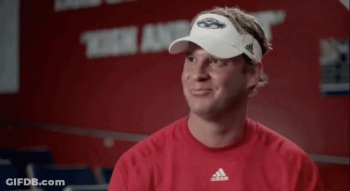 Man With Chest Tattoo Holding Stomach GIF