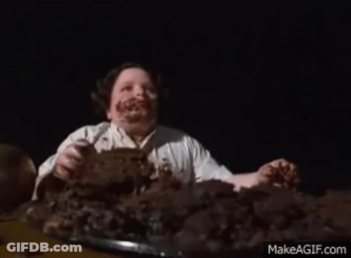 Man With Chocolate Face Eating Cake GIF