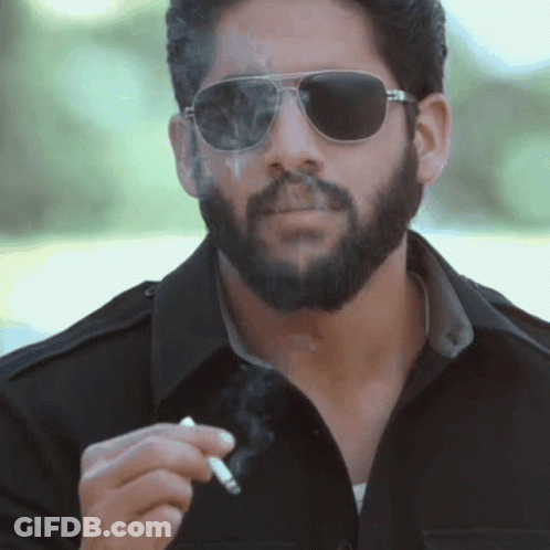 Man With Cigar In Brown Jacket GIF