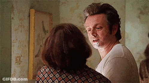 Man With Cigarette Next To Woman GIF