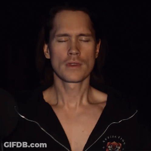 Man With Closed Eyes In Black Rolling Stones Shirt GIF