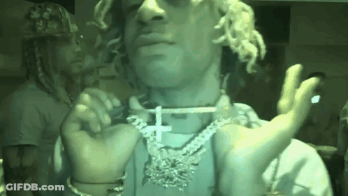 Man With Cross Necklace Holding Cigarette GIF
