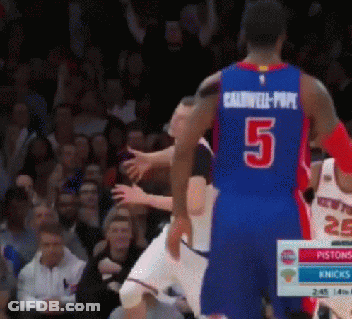 Man With Cross Necklace In Front Of Crowd GIF