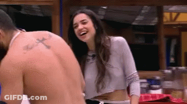 Man With Cross Tattoo Standing Next To Laughing Woman GIF