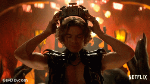 Man With Crown And Netflix Logo Behind Him GIF