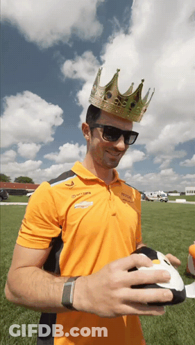 Man With Crown And Sunglasses Holding Football GIF