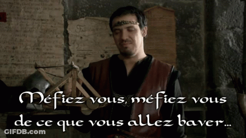 Man With Crown Holding Catapult Says Mefiez Vous GIF