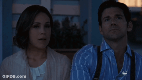 Man With Crown Shirt Standing Beside Woman GIF